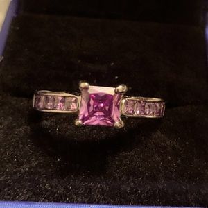 Black stainless steel rind with purple cubic zirconium